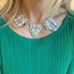 Snakeskin print necklace with Art Deco cut out